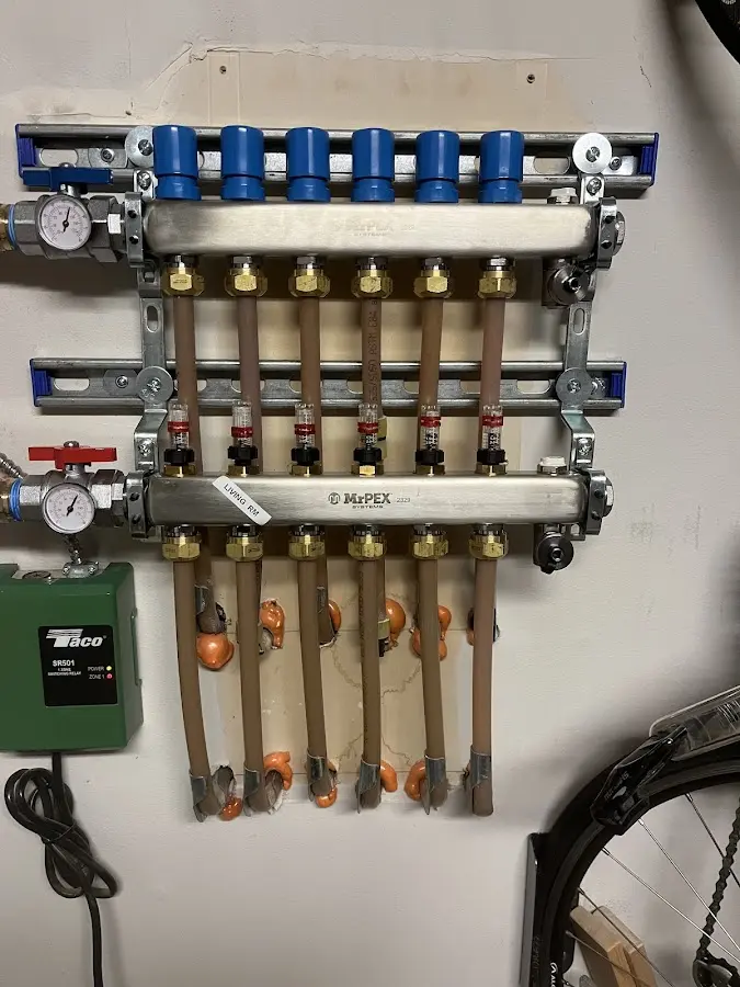 Plumber performing Water Heater Repair at a residential property in Lake Geneva